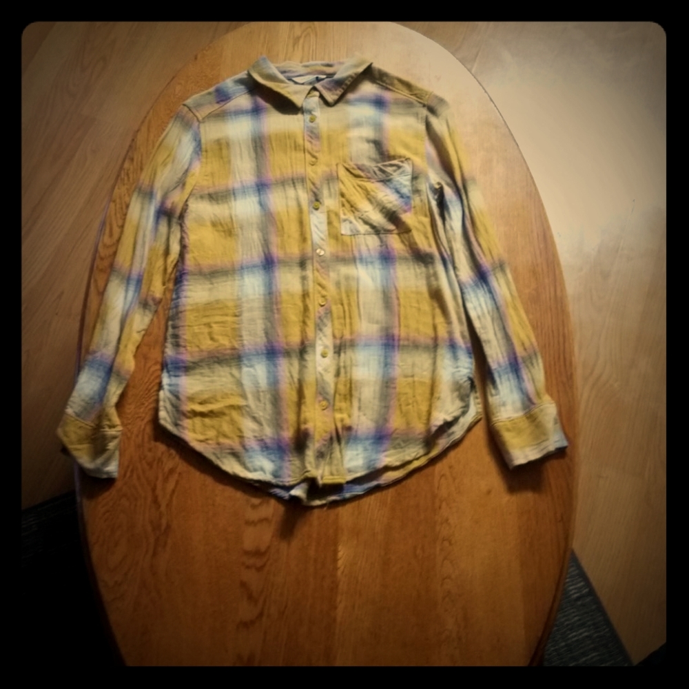 A mustered yellow button down top.